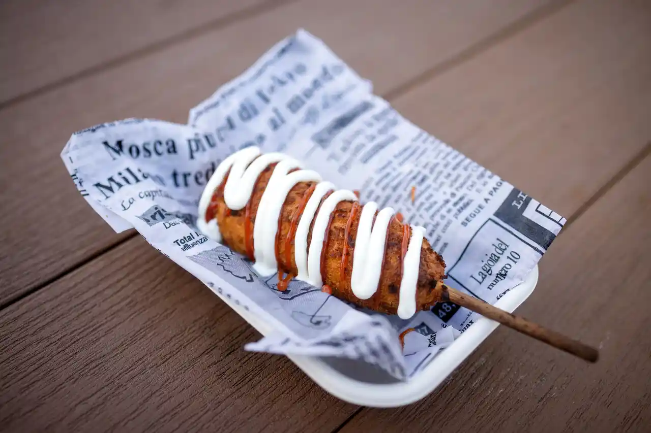 Corn dog and dipping sauce served at Perch Putt
