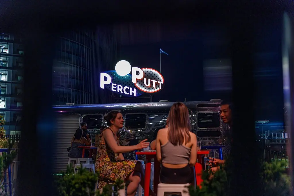 Perch Putt sign above the rooftop venue