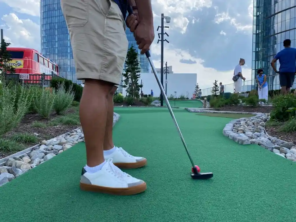 Guest putting on the Perch Putt rooftop course