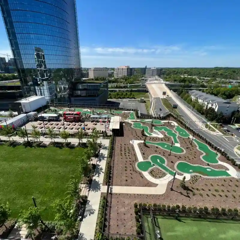 Friends playing mini golf together at Perch Putt